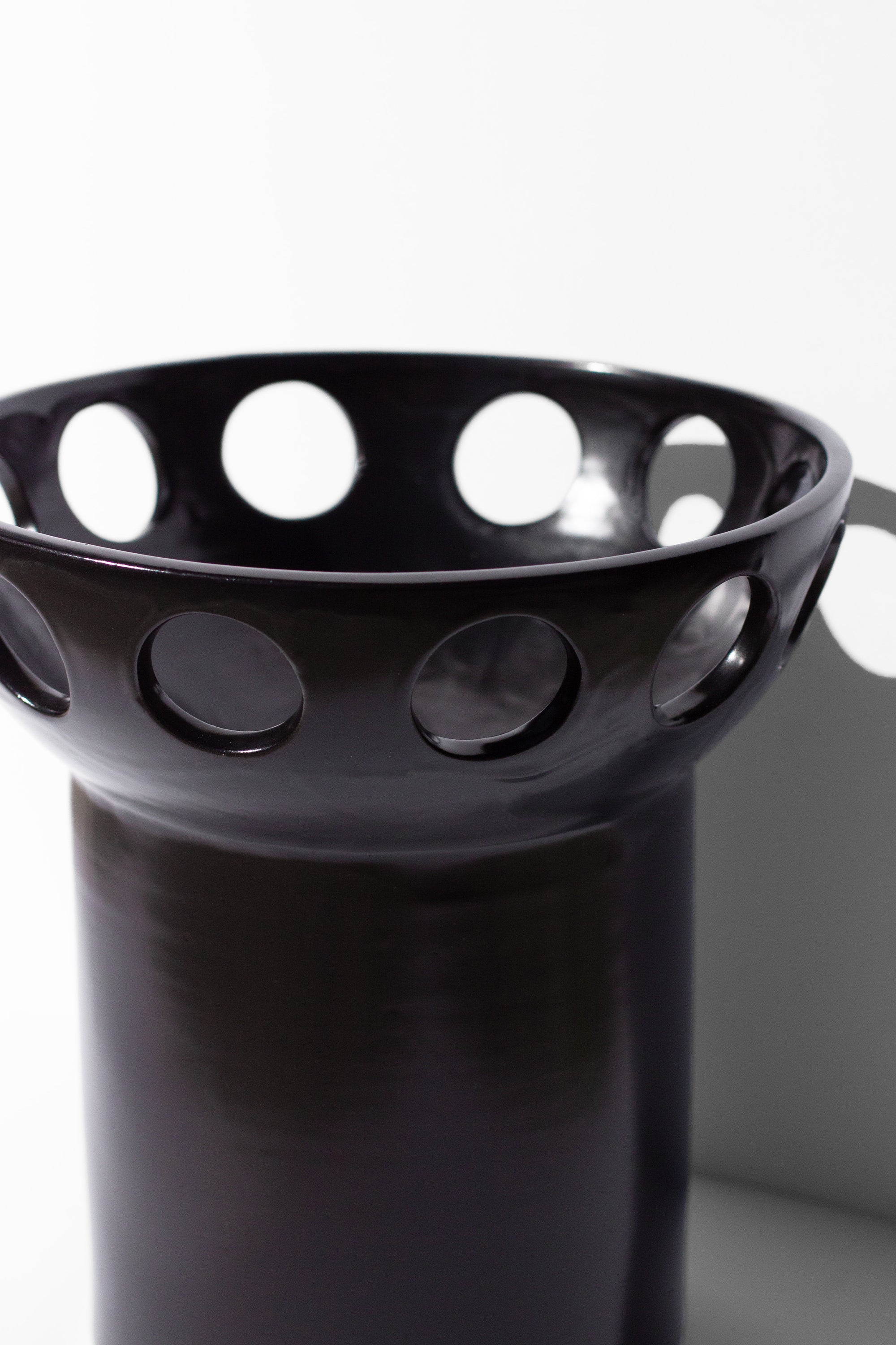 Handmade Black fruit bowl with pedestal base and cutout design