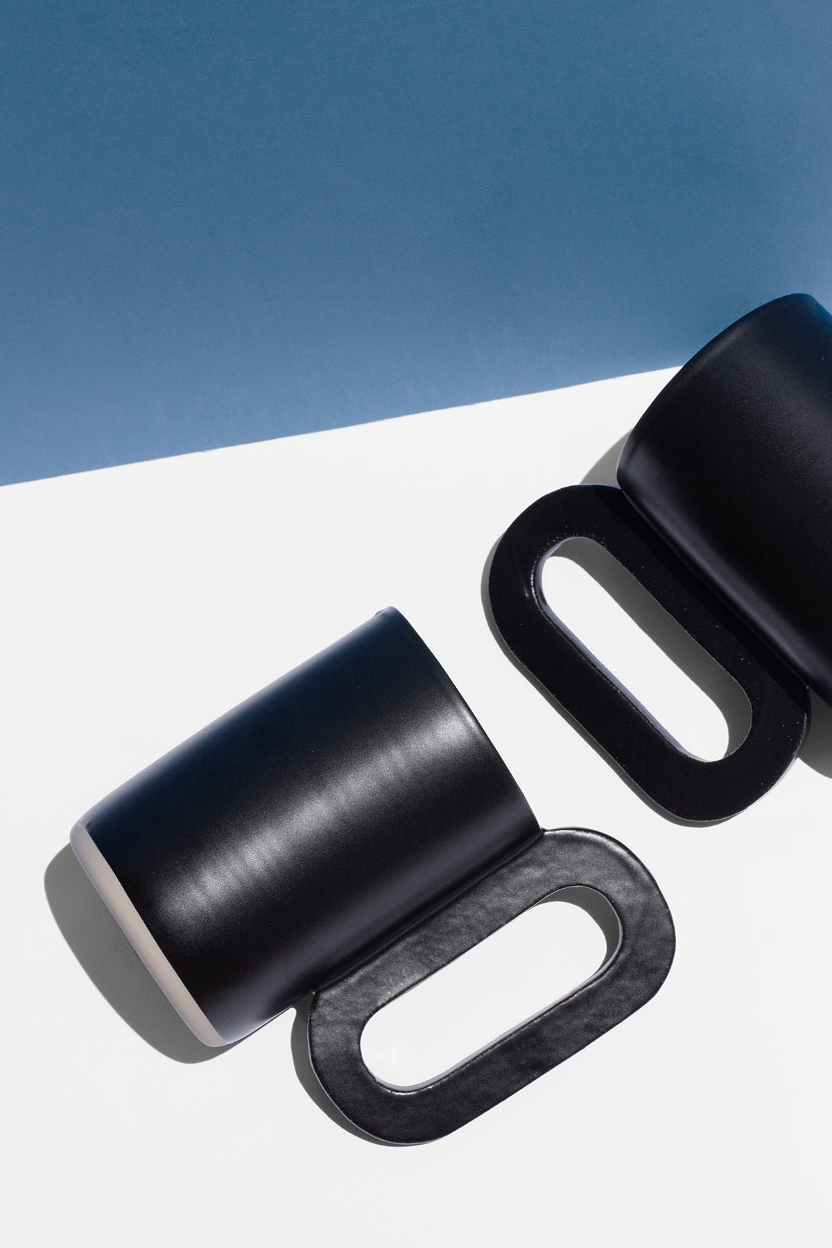 Handmade Tall black mug with loop shaped handle