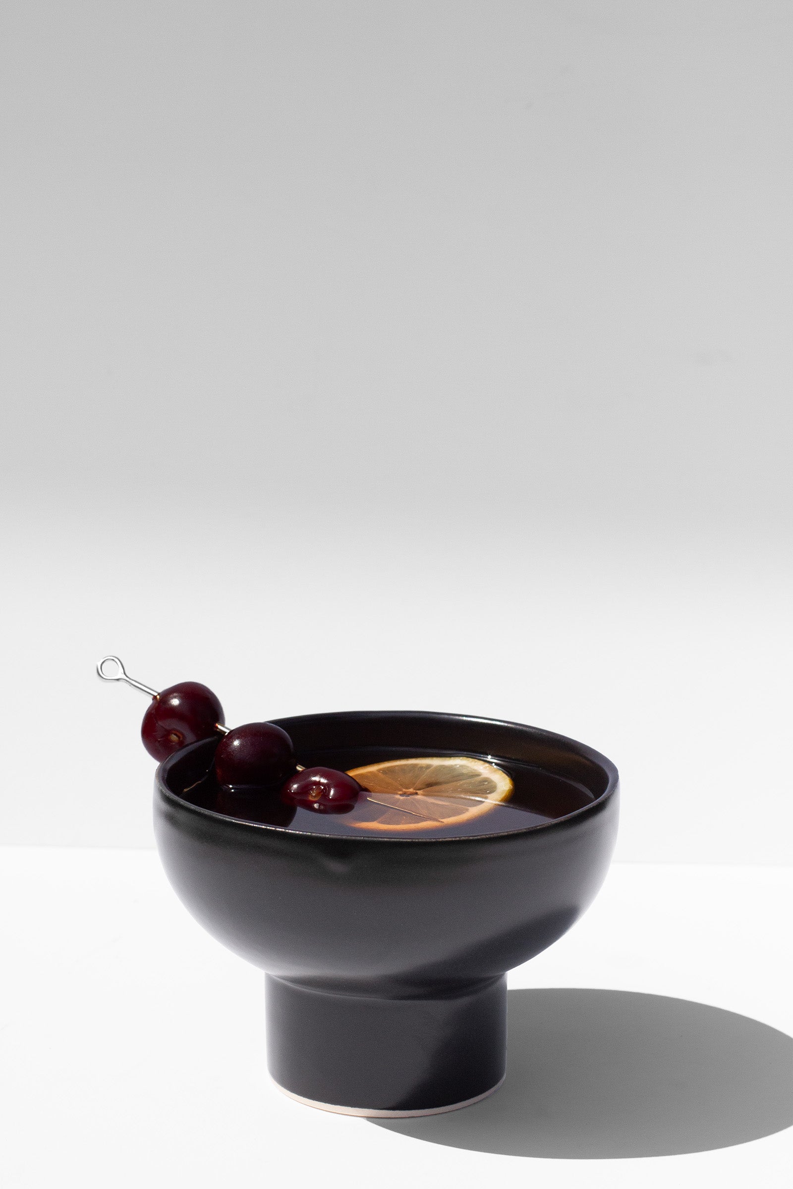 Handmade Black stemless cocktail glasses with wide rim and pedestal base, stackable