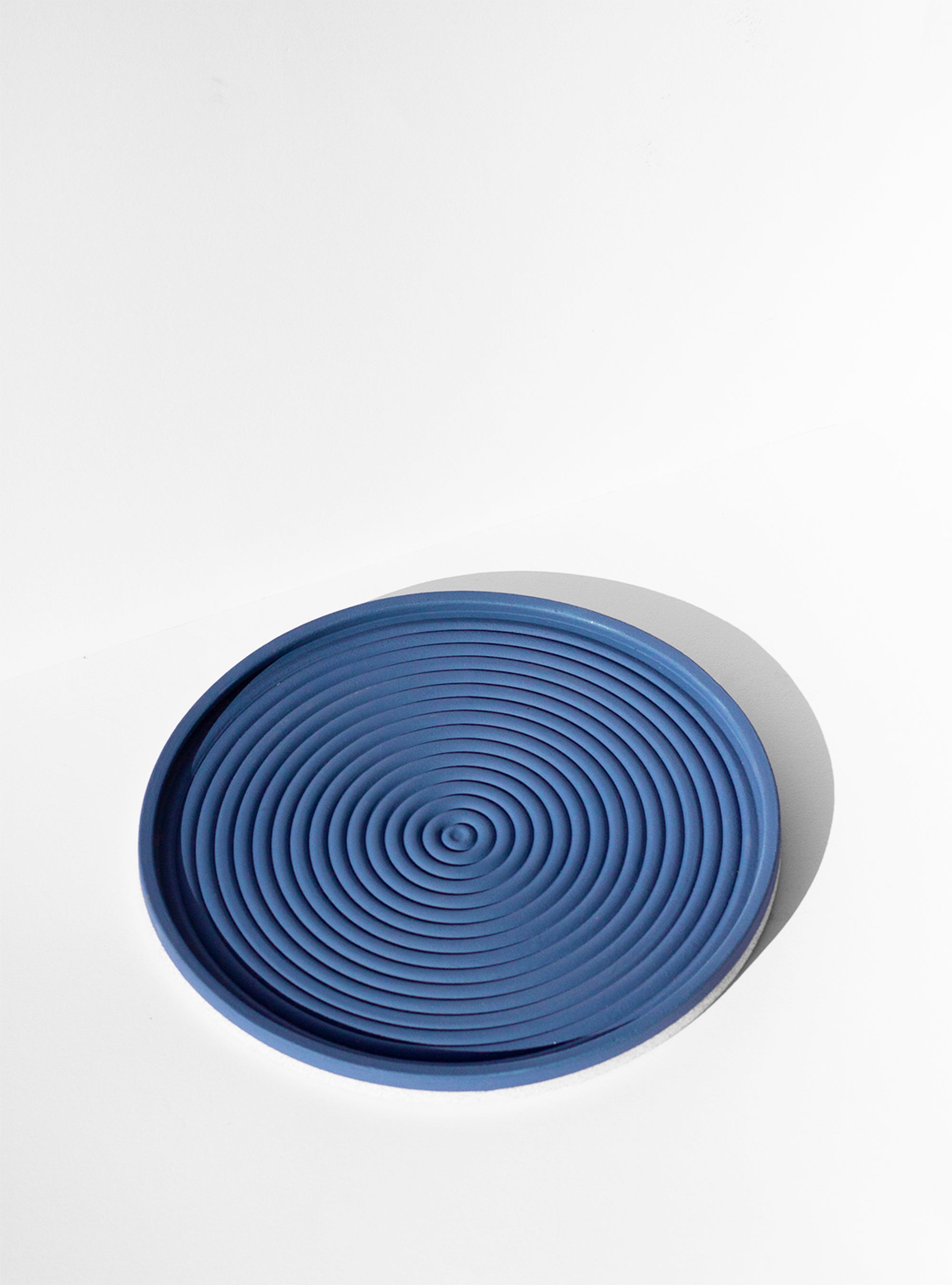 Handmade Cobalt blue serving platter with concentric circle design and speckled finish
