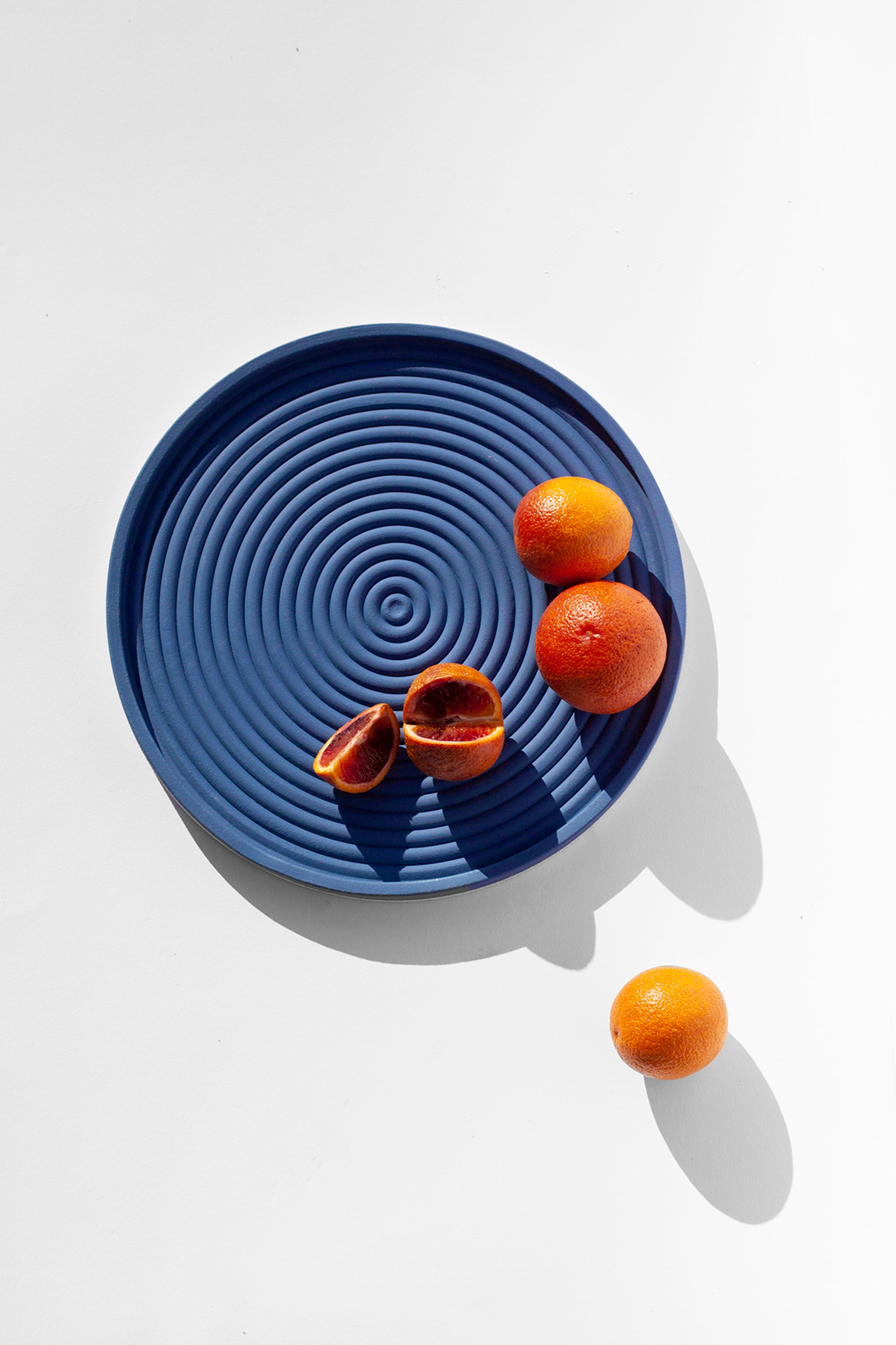 Handmade Cobalt blue serving platter with concentric circle design and speckled finish
