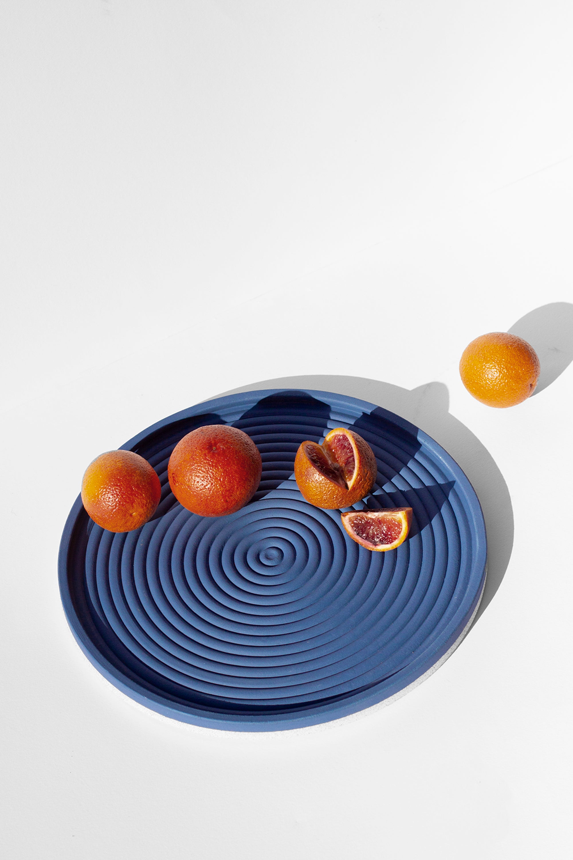 Handmade Cobalt blue serving platter with concentric circle design and speckled finish