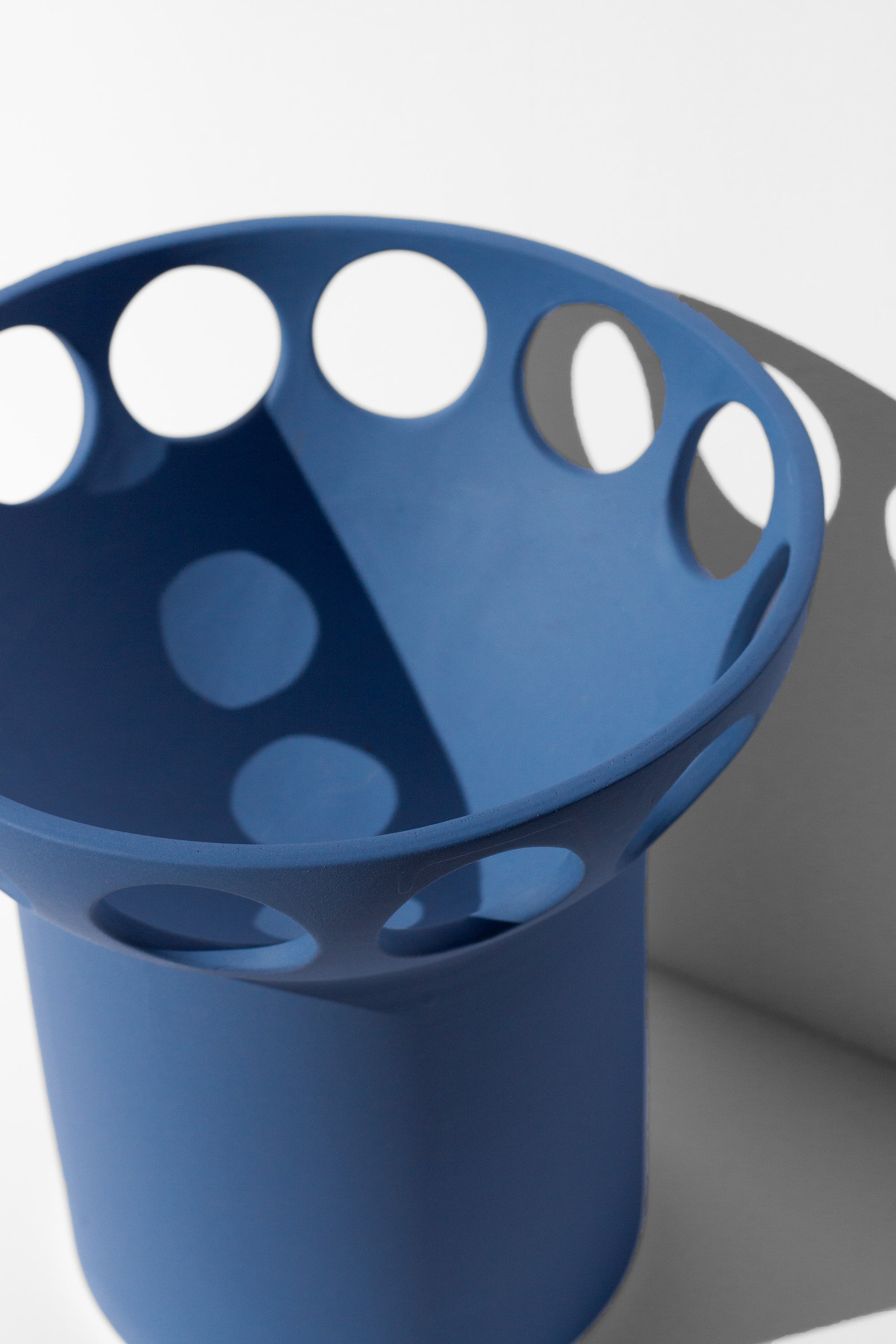 Handmade Cobalt blue fruit bowl with pedestal base and cutout design