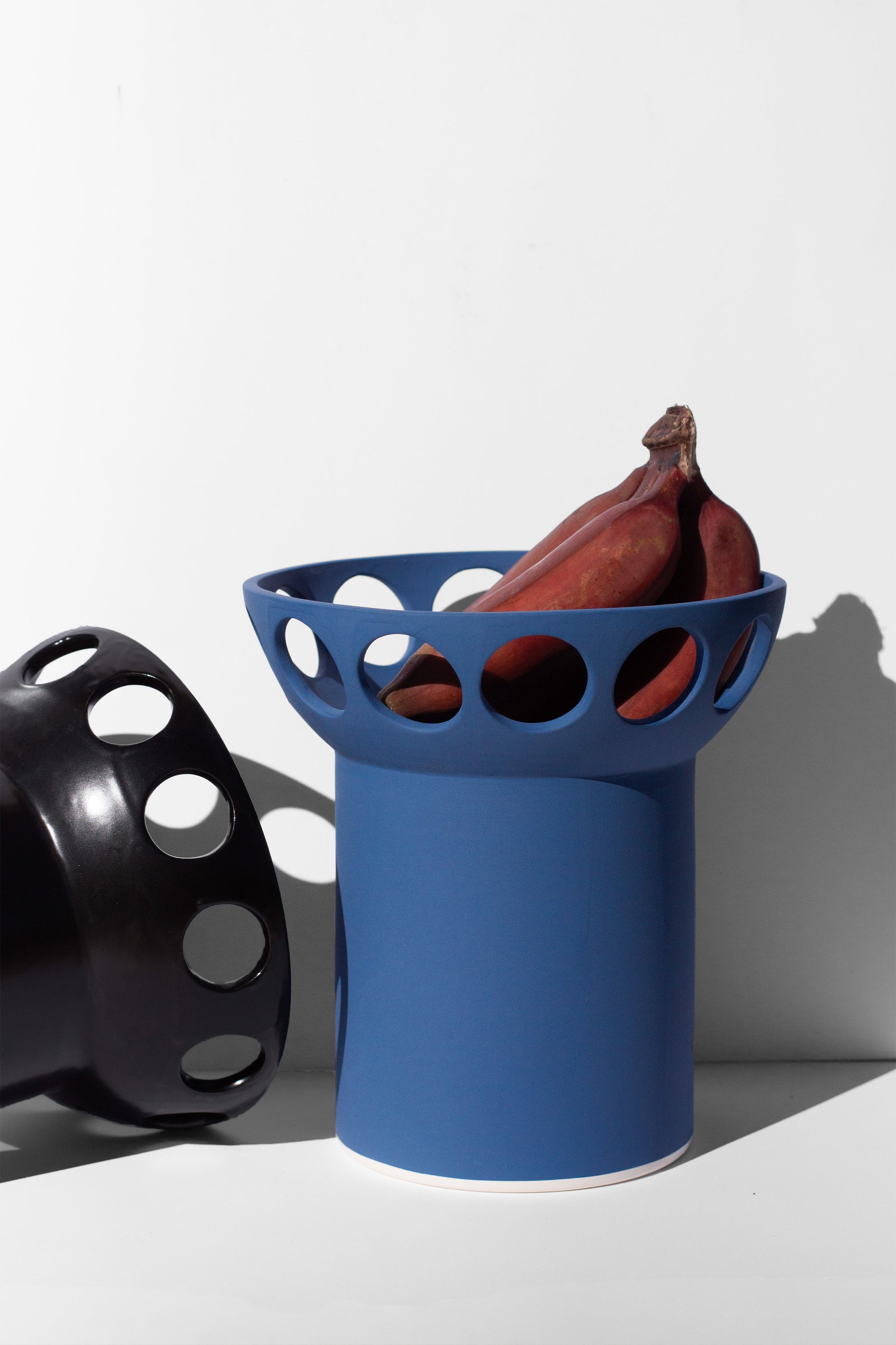 Handmade Cobalt blue fruit bowl with pedestal base and cutout design