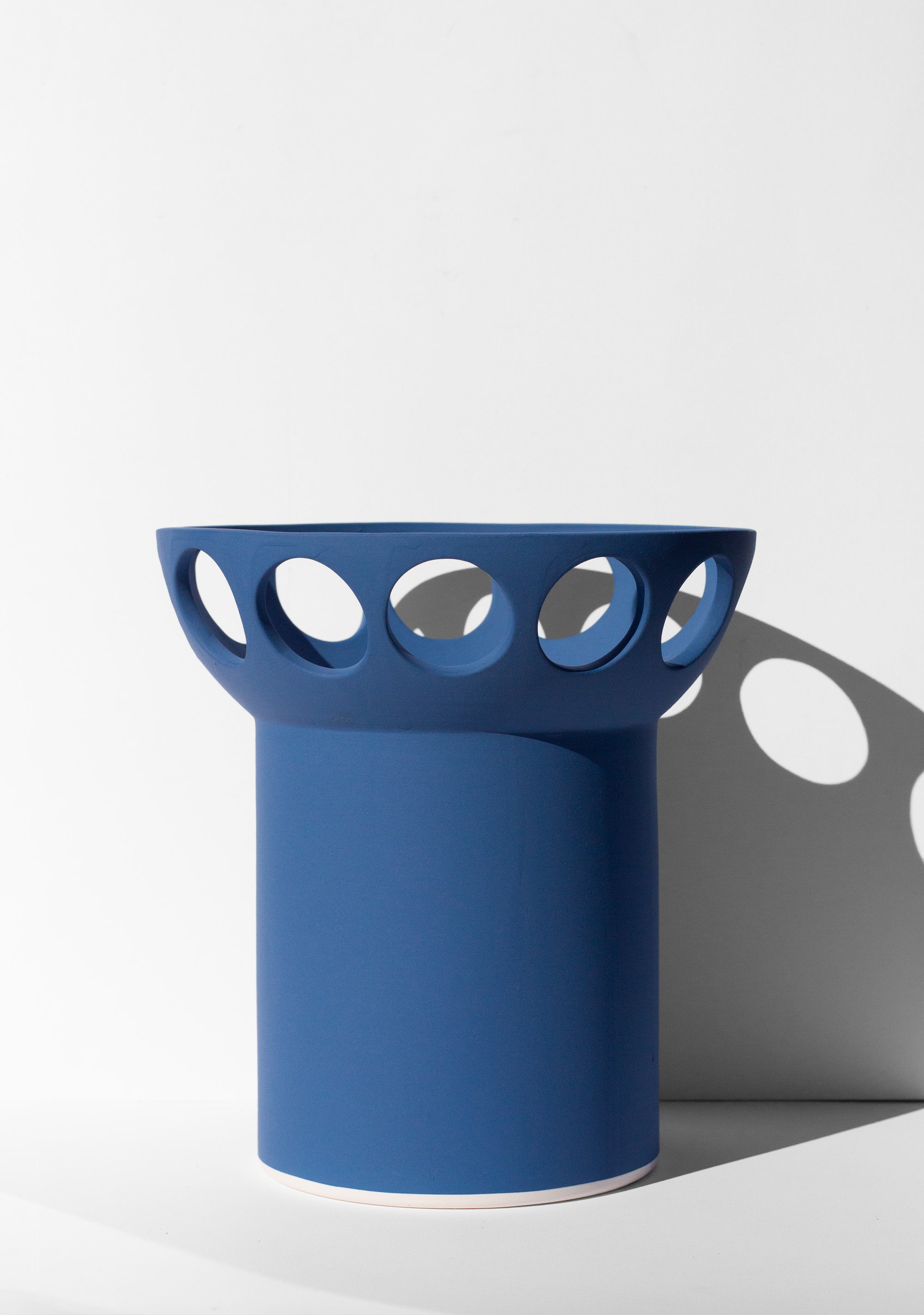 Handmade Cobalt blue fruit bowl with pedestal base and cutout design