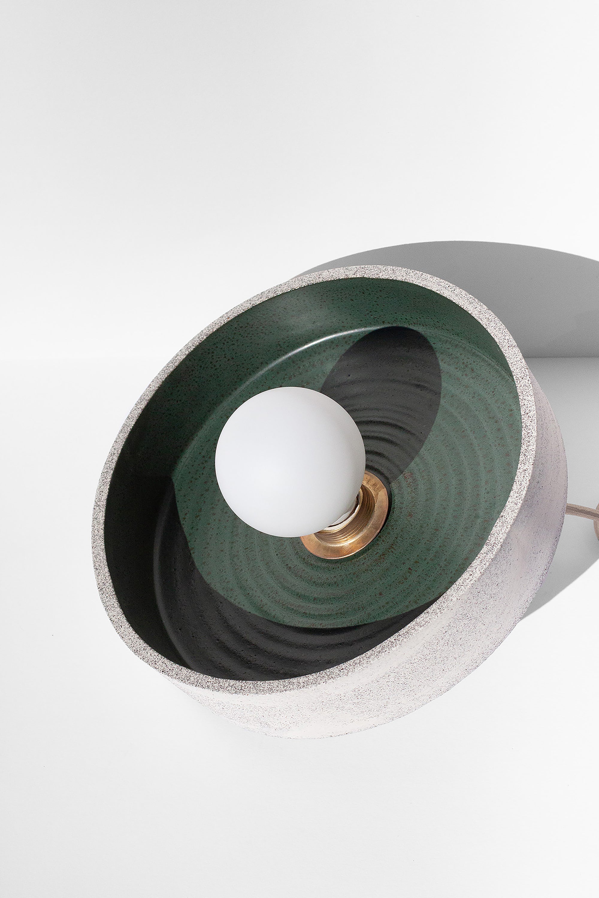 Handmade Green pendant light with concentric circle design and natural speckled finish