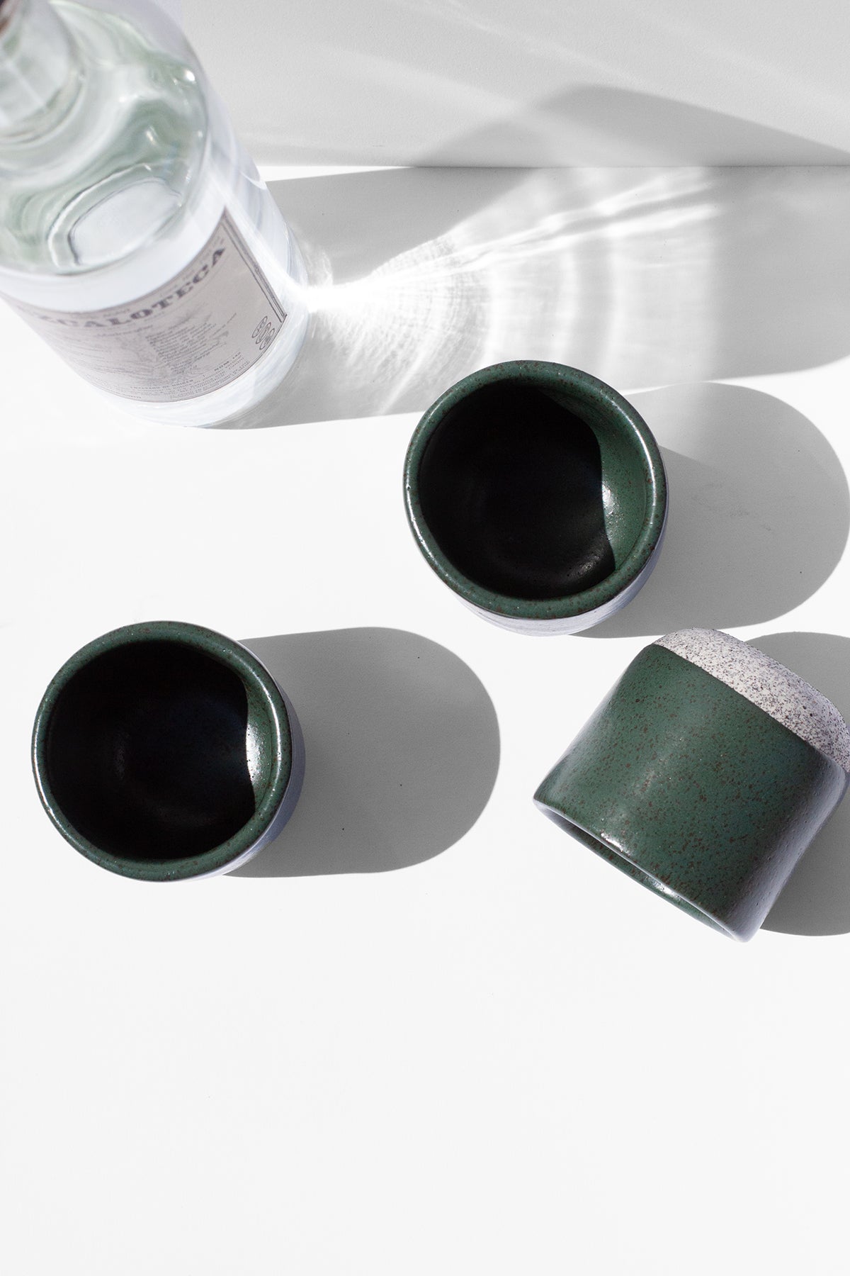 Handmade Small green cups for sipping espresso or spirits with speckled finish
