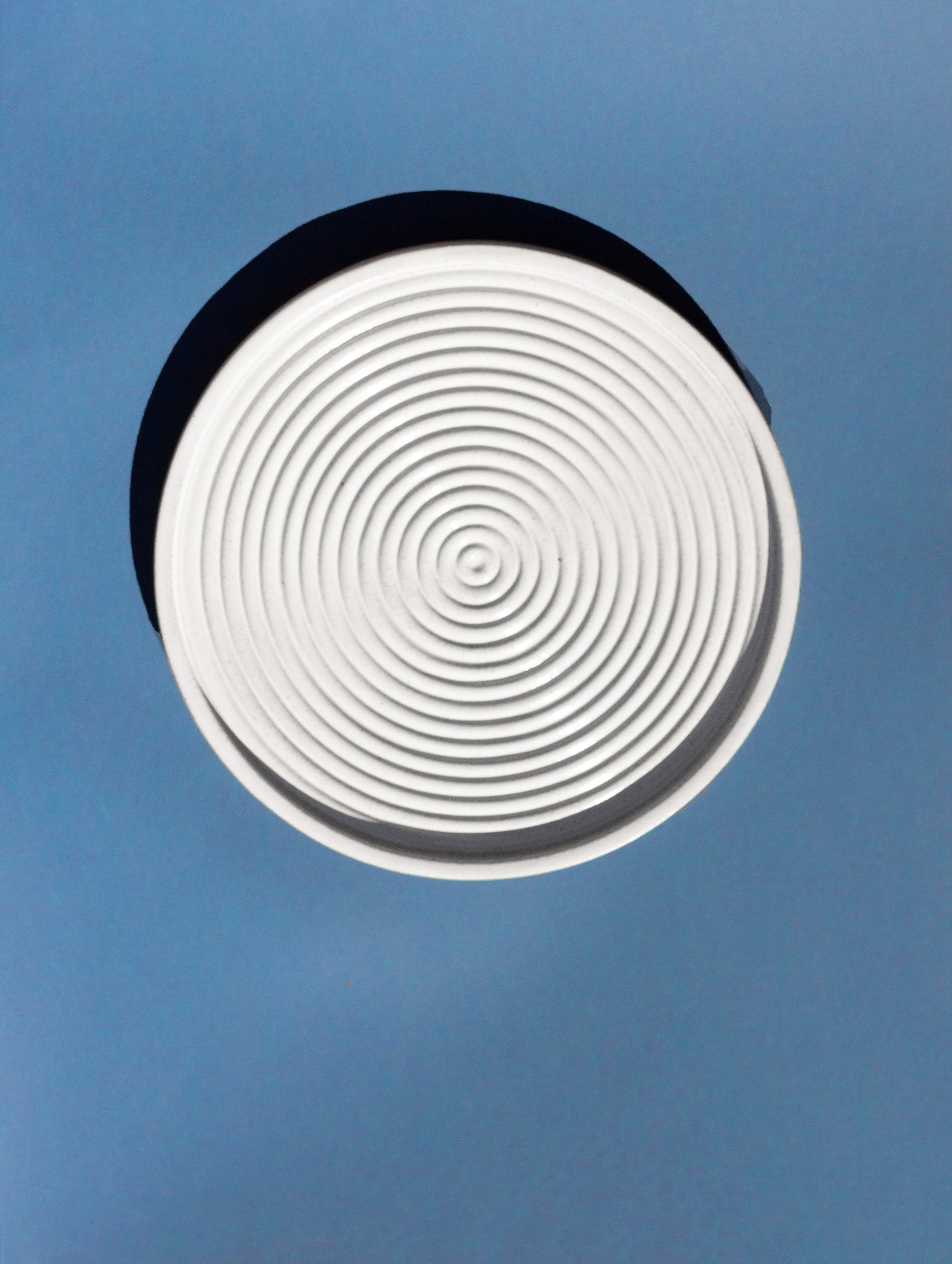 Handmade White serving platter with concentric circle design and speckled finish