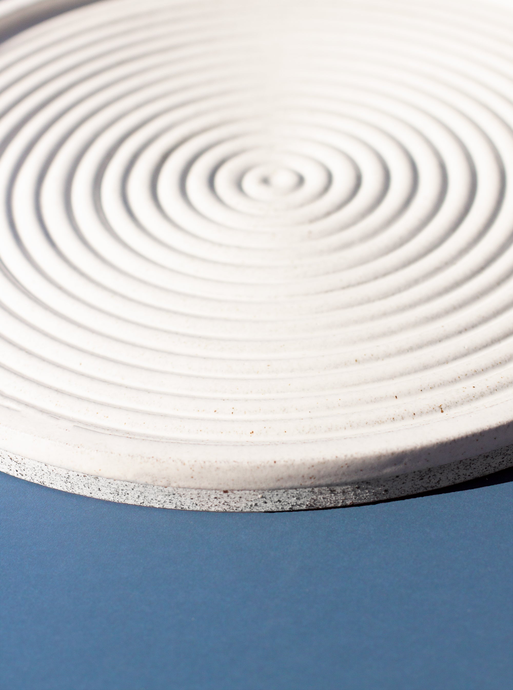 Handmade White serving platter with concentric circle design and speckled finish