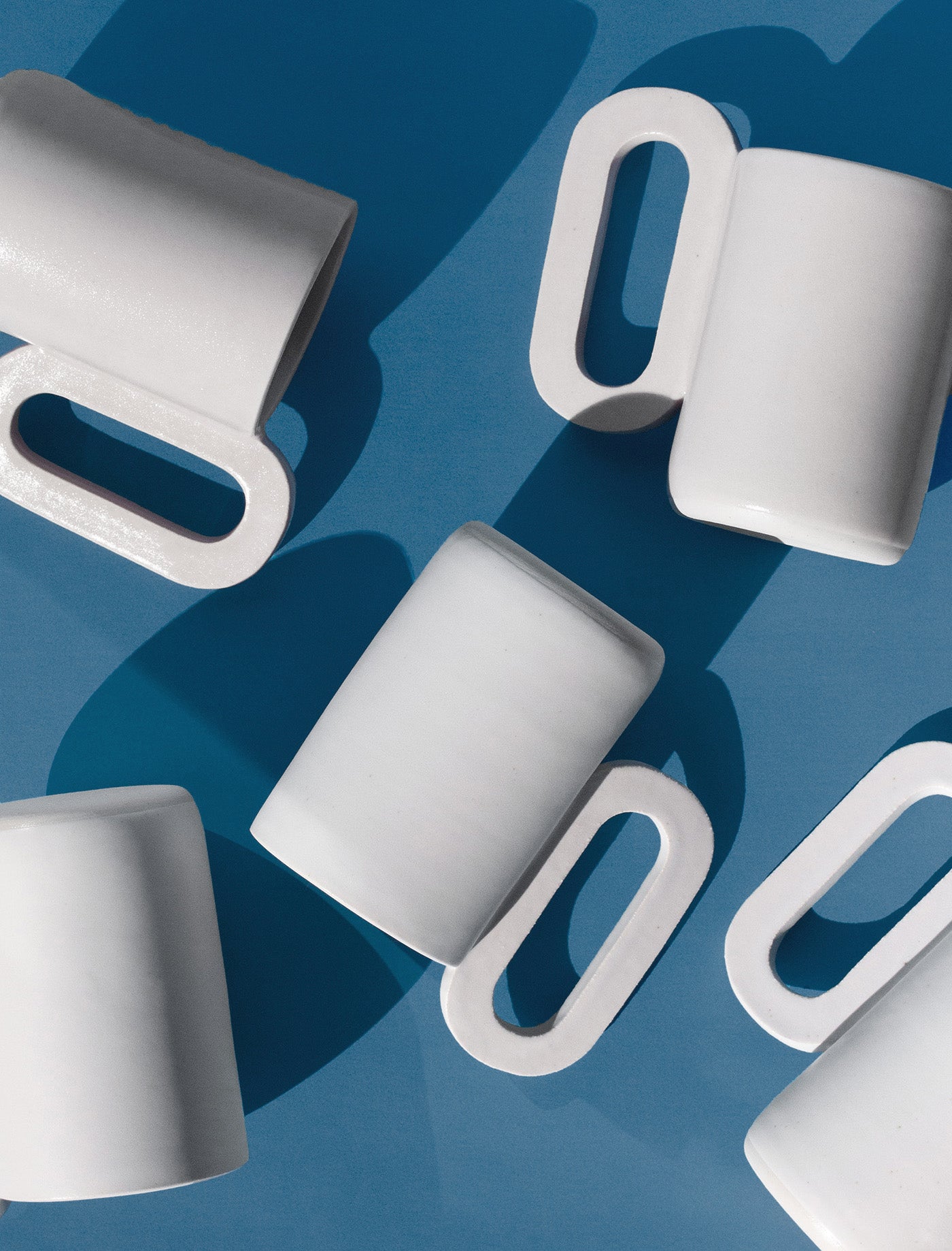 Handmade Tall white mug with loop shaped handle