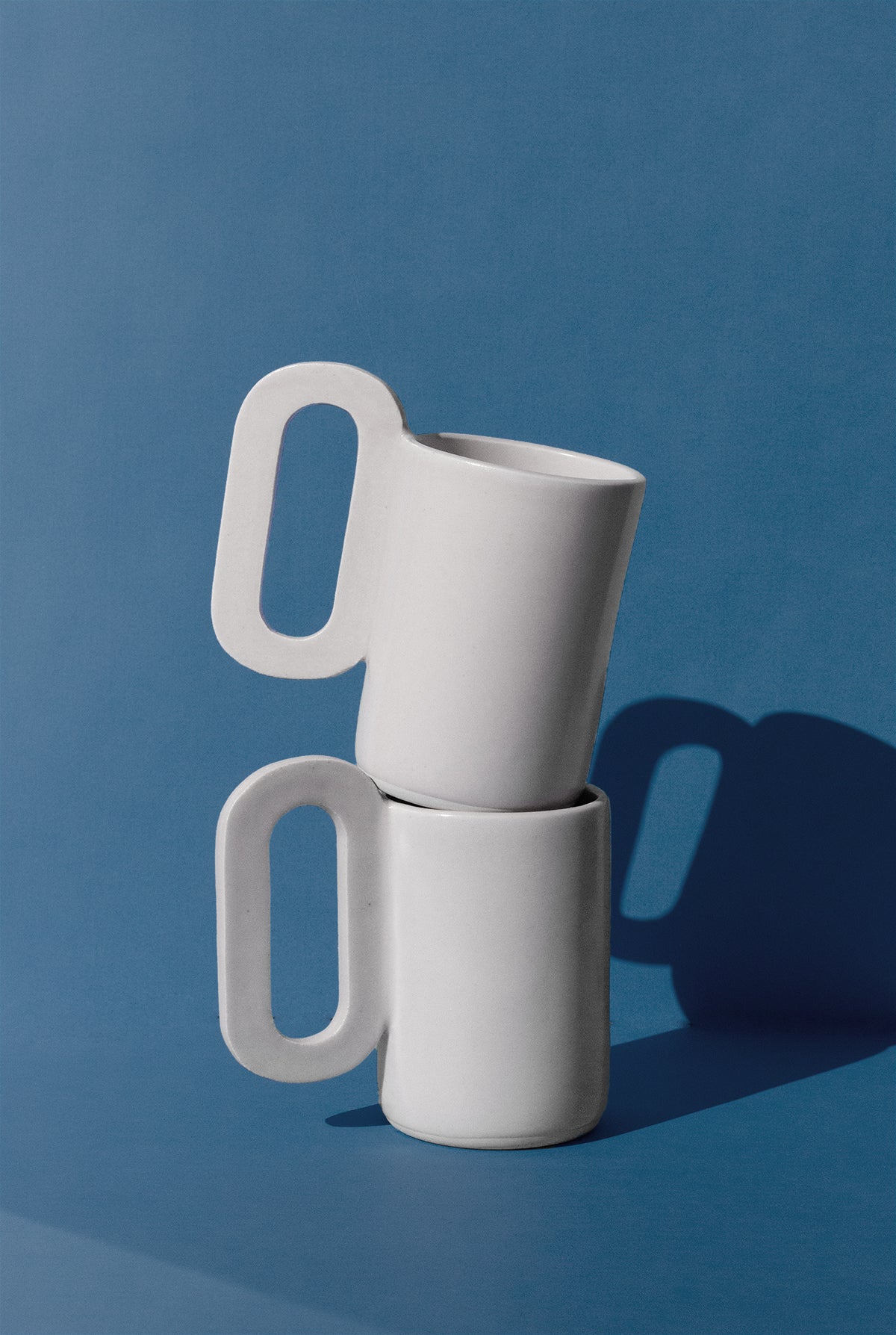 Handmade Tall white mug with loop shaped handle